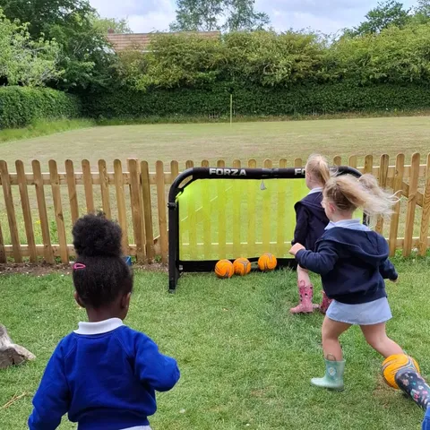 Children exploring nature during Forest School sessions