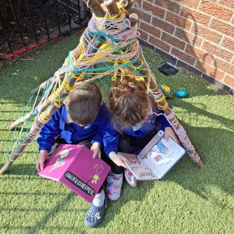Children sharing stories and books together at the pre-school