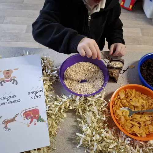 Child enjoying a healthy breakfast at Early Years Educare