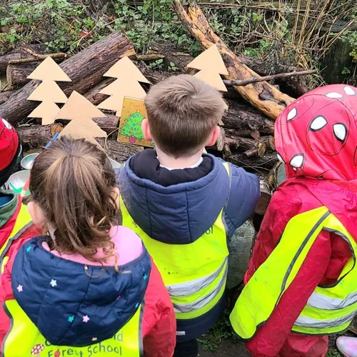 Children engaged in outdoor learning activities at Early Years Educare