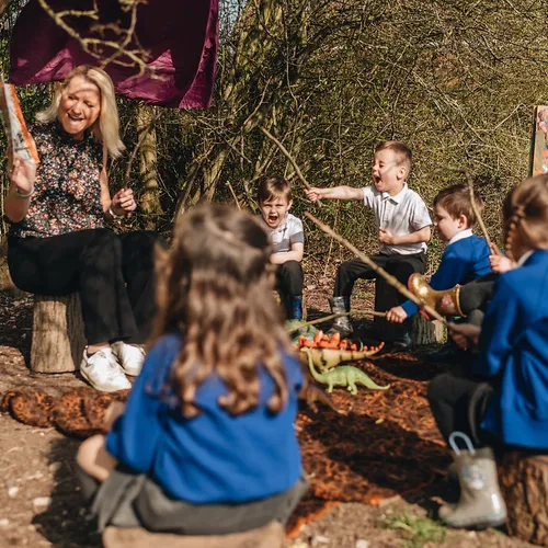 Children engaged in outdoor learning activities at Early Years Educare