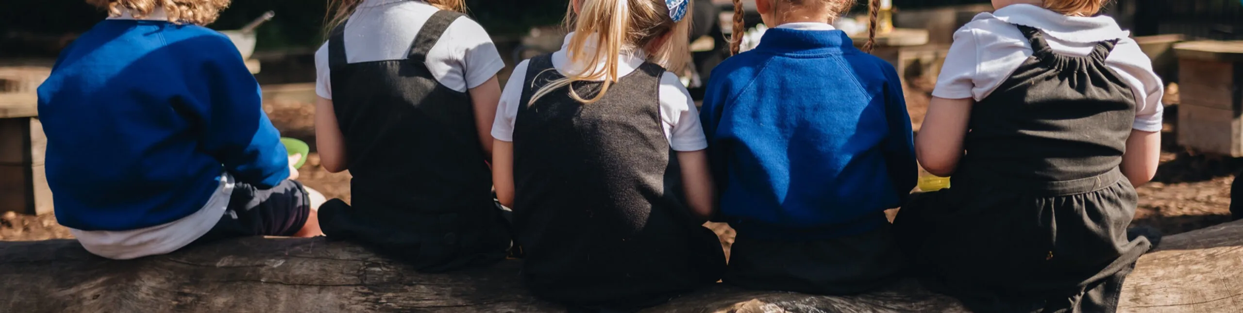 Children playing outdoors at Early Years Educare pre-school