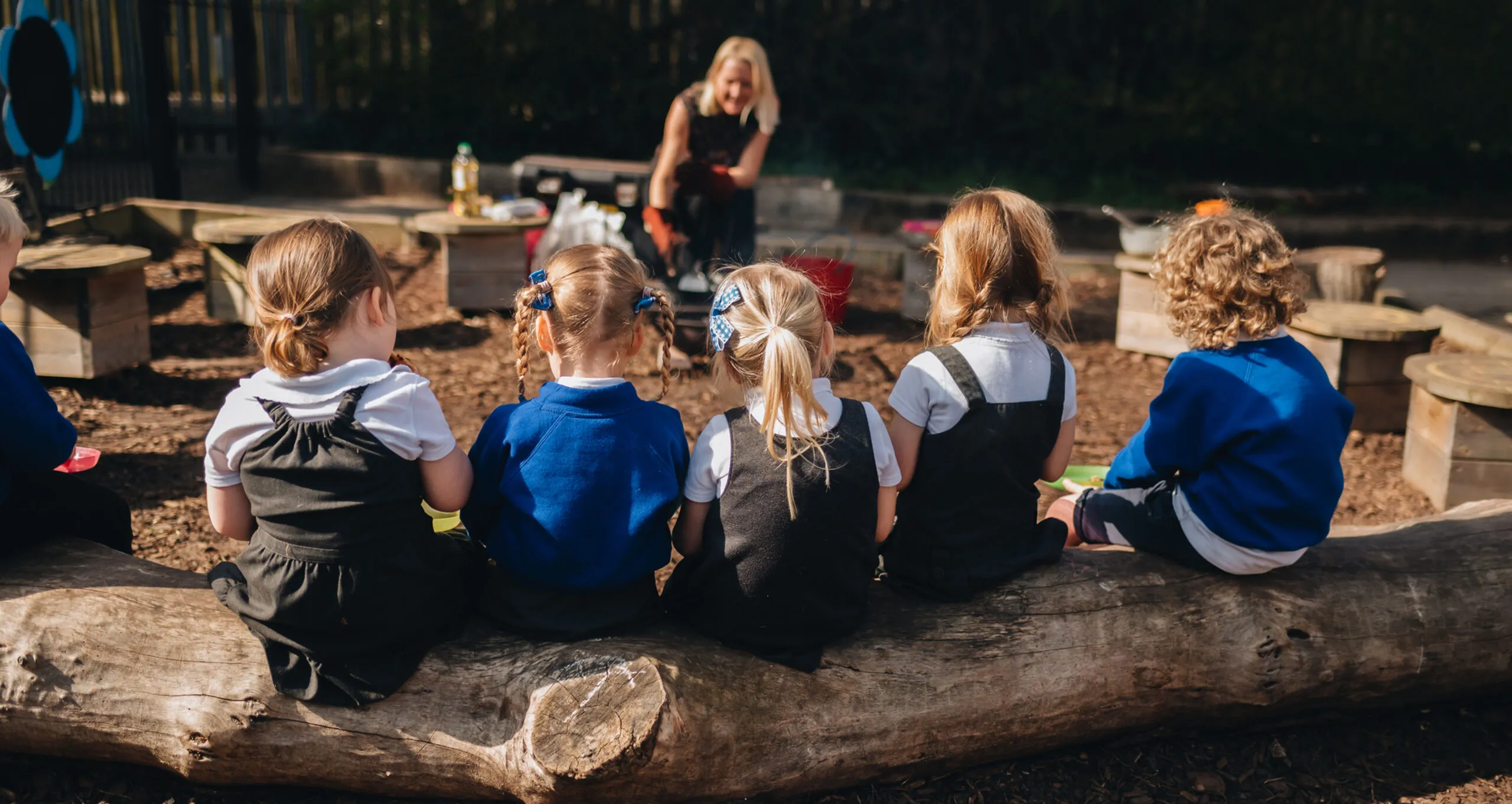 Children learning outdoors at Grant Thorold Forest School